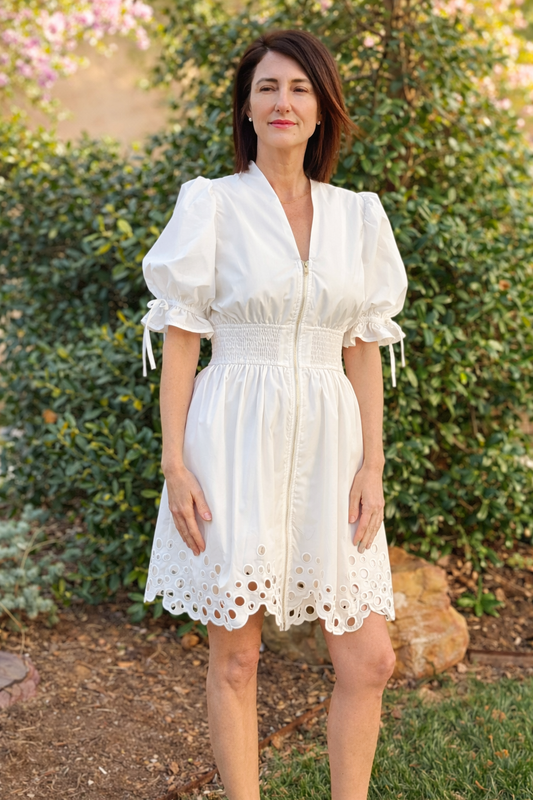 ivory puff sleeve mini dress with smocked waist, front zipper, and scalloped eyelet hem boutique summer dress