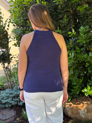 Navy sleeveless halter knit top back view showing clean silhouette and fitted design styled for casual summer outfit
