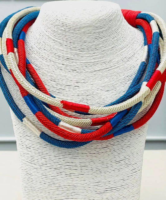 red white and blue multi strand cotton rope statement necklace with layered patriotic design and ball and eye closure boutique jewelry
