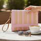 pink and natural striped woven foldover clutch with wristlet strap boutique handbag