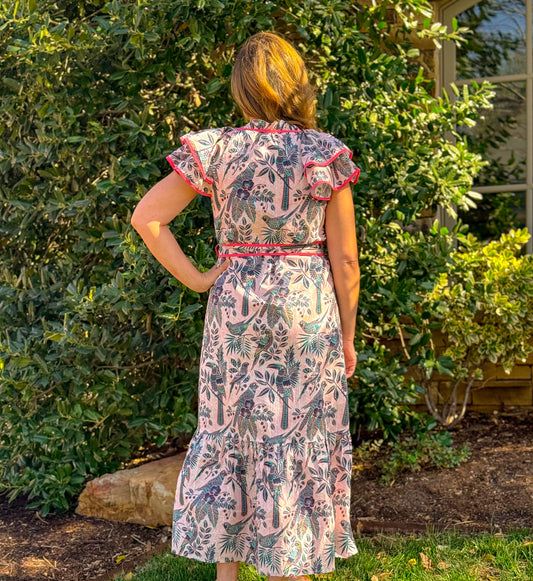 Women’s pink printed midi dress with belted waist, contrast piping, and flutter sleeves perfect for spring events and casual outings
