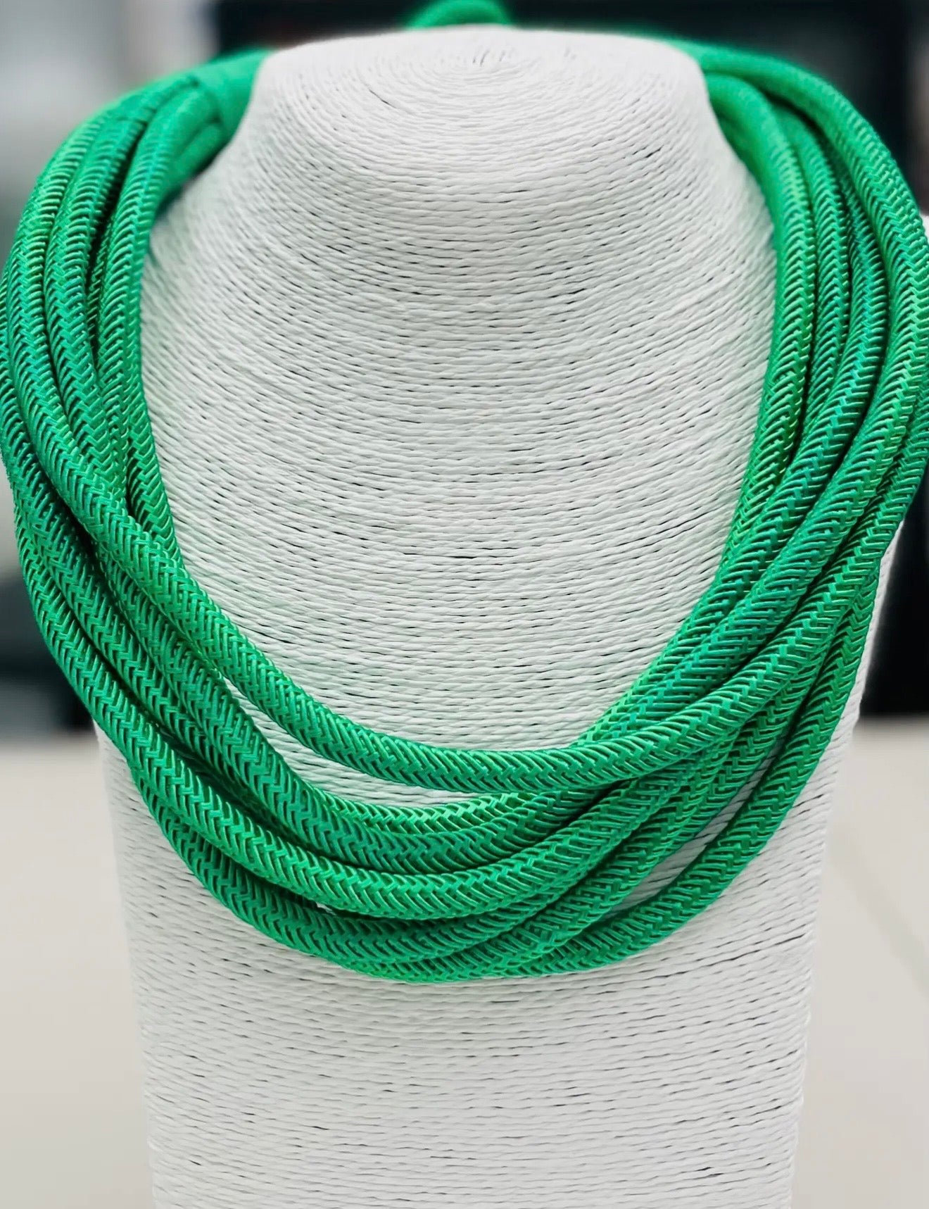 Emerald green multi strand cotton rope statement necklace with layered design and ball and eye closure boutique jewelry