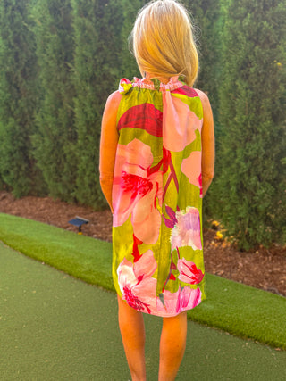 Back view of green and pink floral halter mini dress with tie neck and flowy silhouette