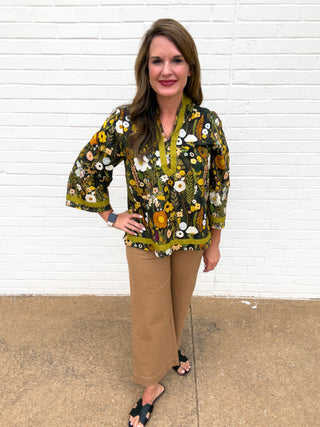 Women’s camel brown high-waisted wide-leg pants with front patch pockets and cropped ankle-length fit
