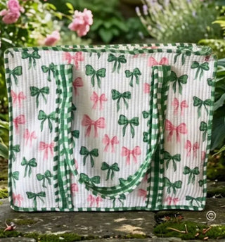 Pink and green bow quilted tote bag with gingham straps and structured design for everyday use
