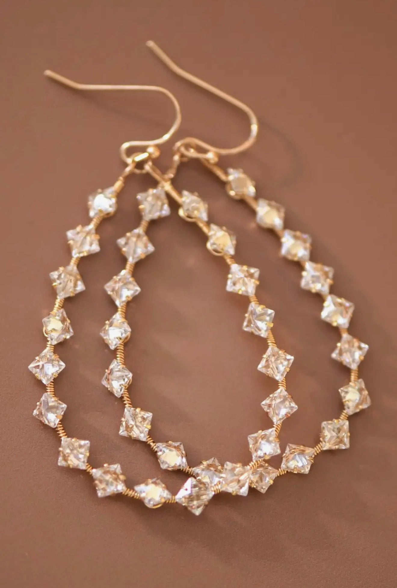 wire wrapped zircon crystal teardrop dangle earrings with gold beaded design
